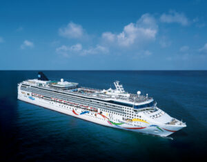 ncl DAWN Dolphin side at sea NEW HULL